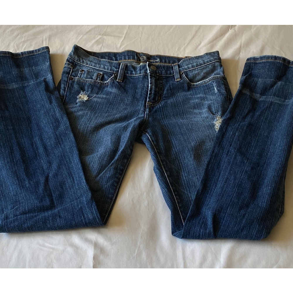 NWOT BEBE Women’s Distressed Jeans with Red Rhinestones in the Back Pockets!